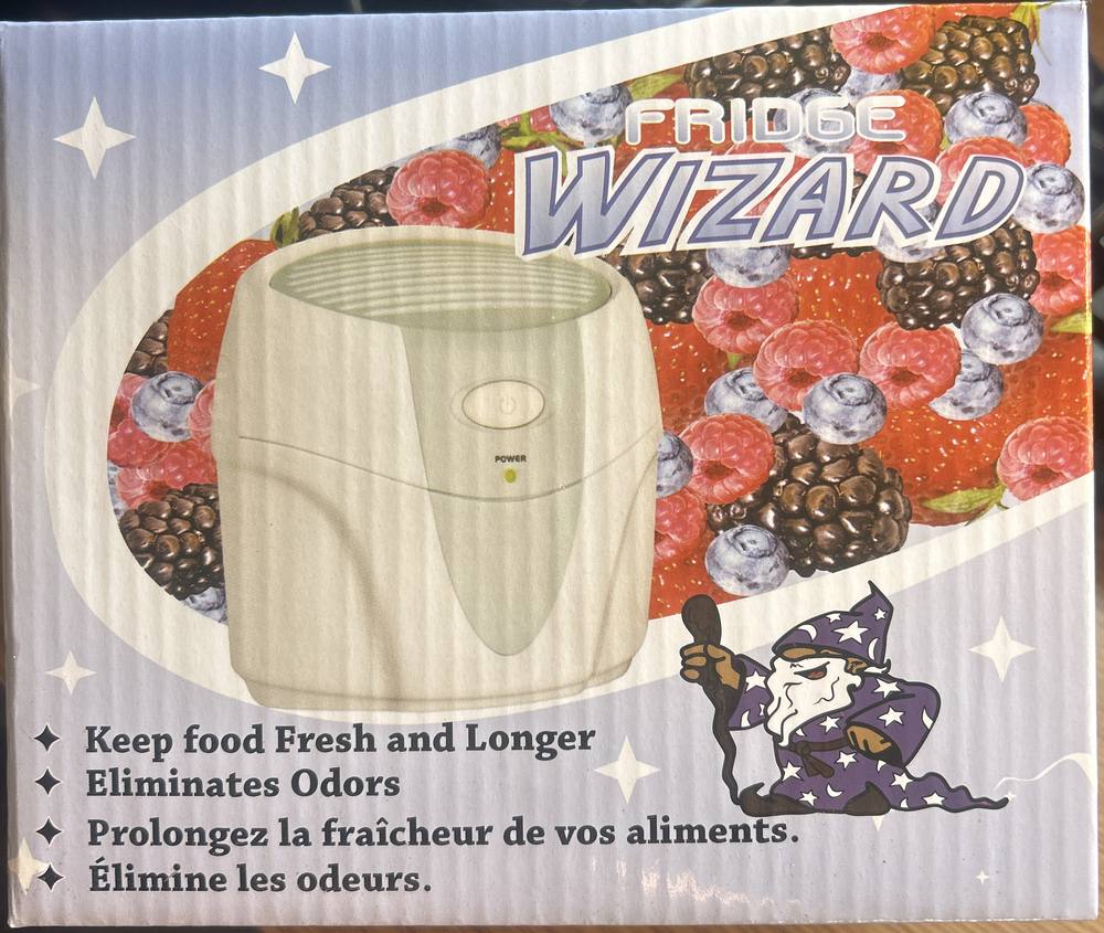 The Fridge Wizard retail box: front panel with the Fridge Wizard logo, a product image, berries and the wizard mascot